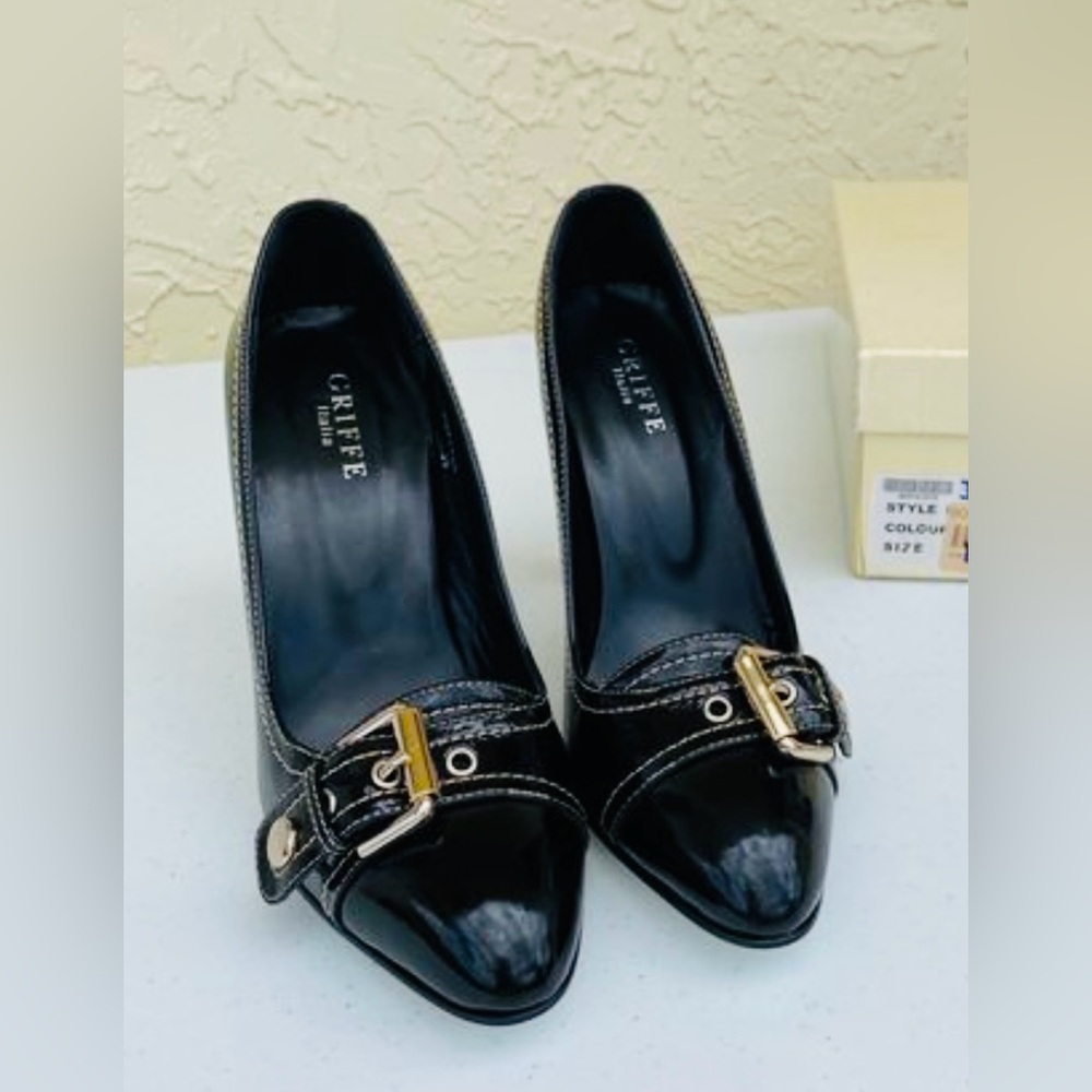 Italian black patent leather styled pump; 4 1/2 inch heel, size 39.